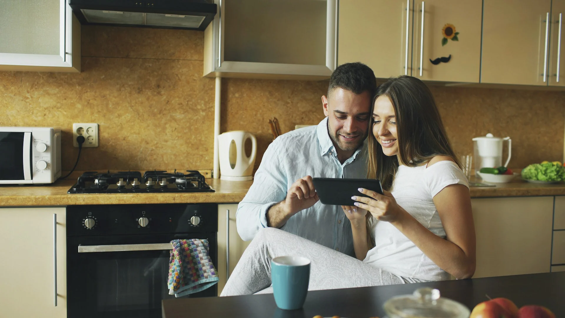 Couple at home looking at mortgage information together